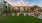 Elegant apartment complex with lush green lawns, inviting lounge chairs, and vibrant landscaping under a beautifully serene sky at Ona in Sacramento
