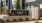 Modern apartment complex in Sacramento entrance showcasing contemporary design and lush landscaping.