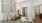 Inviting bedroom with elegant wall art, cozy queen-sized bed, and warm lighting, leading to a spacious walk-in closet at Ona Natomas in Sacramento