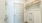 Modern closet with chic wicker baskets, ample hanging space, and sleek design at Ona Natomas