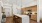 Modern kitchen with sleek island, elegant pendant lighting, and stylish wooden cabinetry for a contemporary touch at Ona Natomas