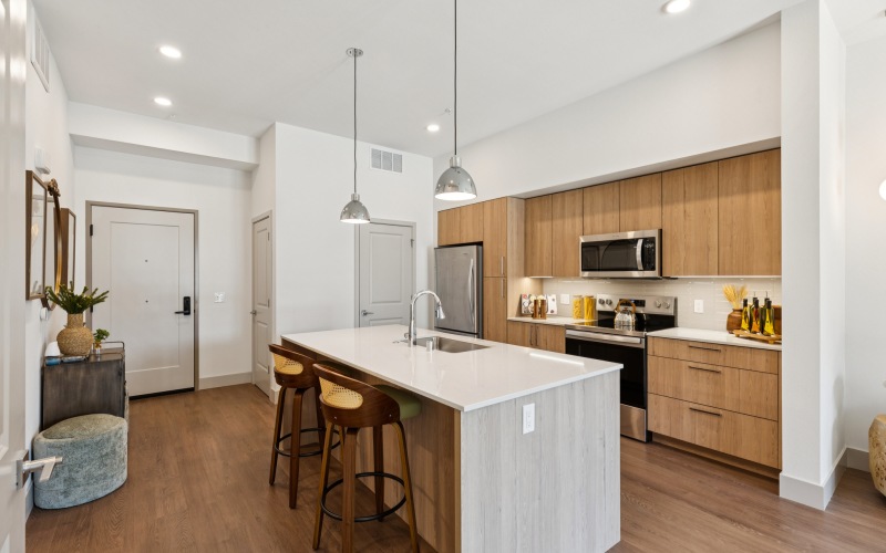a kitchen with barstools